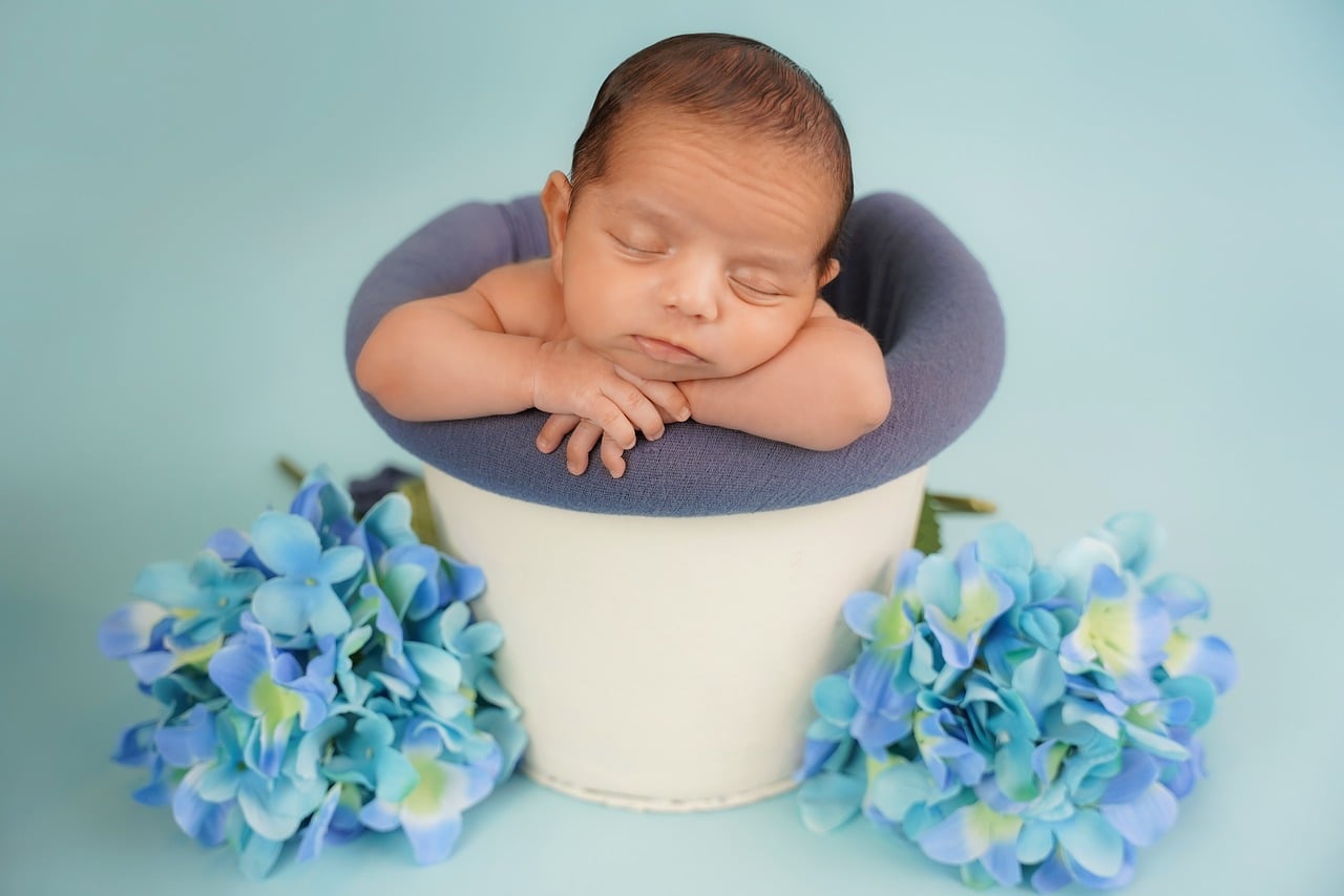 A first birthday photoshoot setup with props and balloons